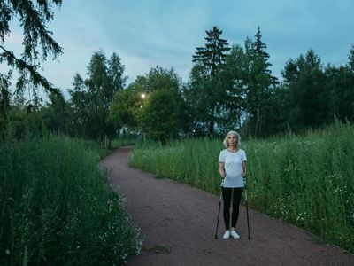 Active senior person walking in the park