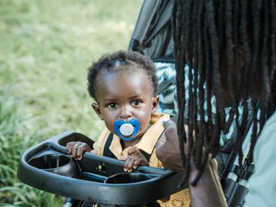 Young parent with stroller staying active